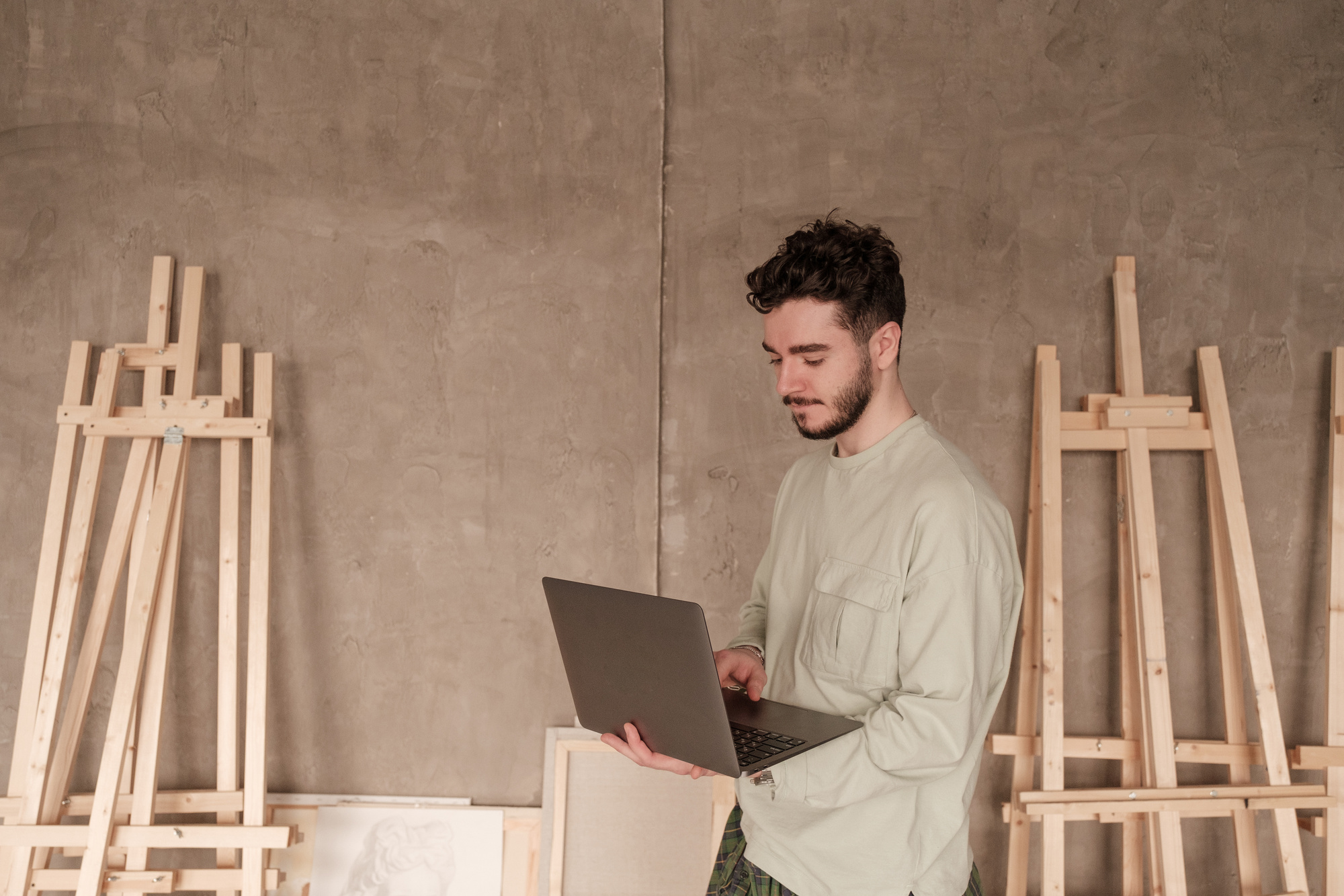 Student with Laptop in Art Studio